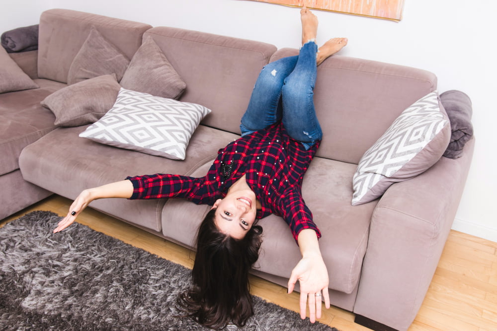 smiling young woman messing around living room