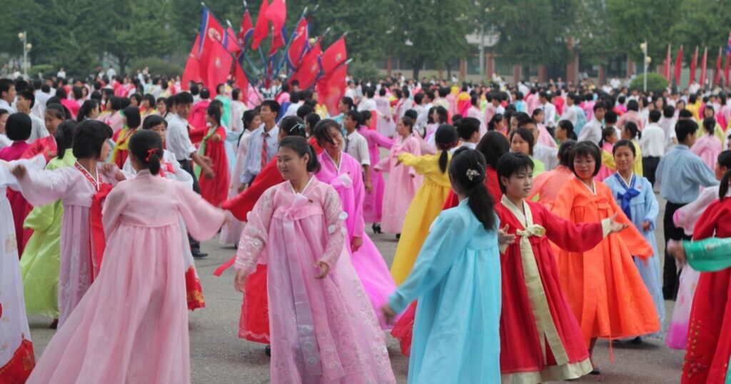 women dance in north korea while wearing traditional dresses