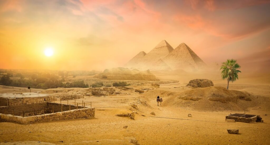 Egyptian pyramid in sand desert and clear sky