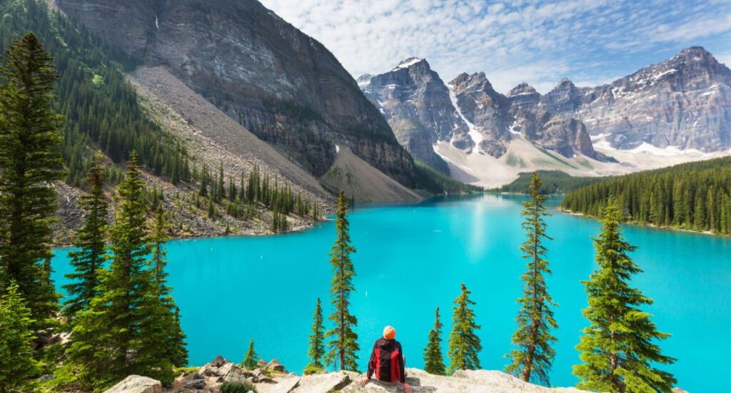 Turquoise waters of the Moraine lake with snow-covered peaks