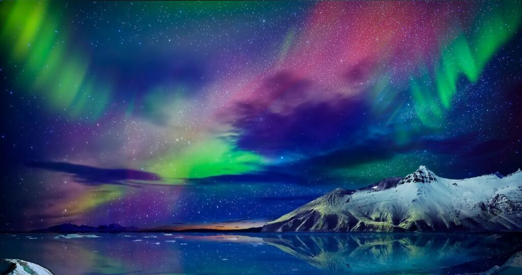 the northern lights over the mountains in alaska