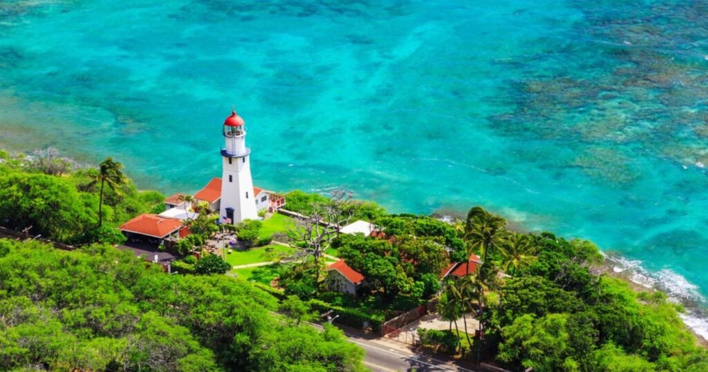 the view of a lighthouse and an offshore reef in honolulu, hawaii